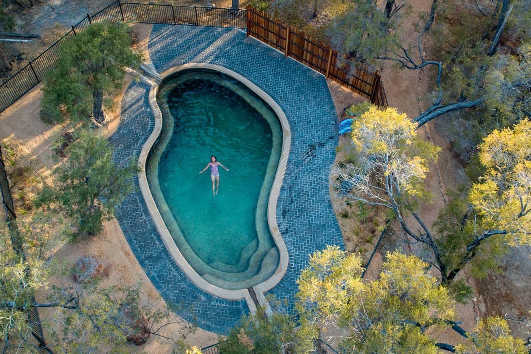 a woman in a pool seen from the air